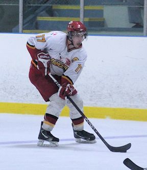 Matt McClinchey of the Lancers, brings the puck in over the blue line